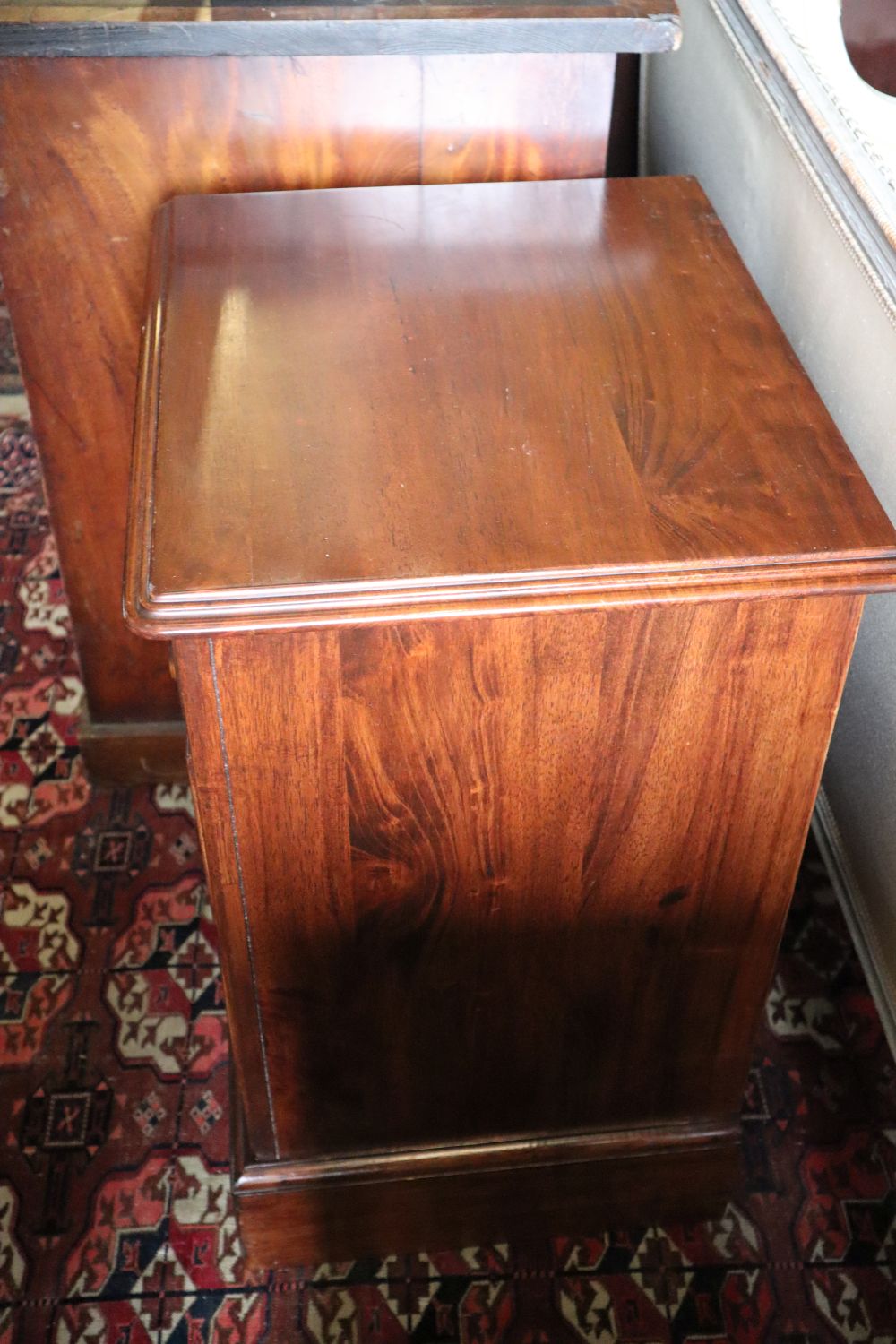 A pair of Willis & Gambier walnut three drawer bedside chests, width 50cm depth 40cm height 66cm